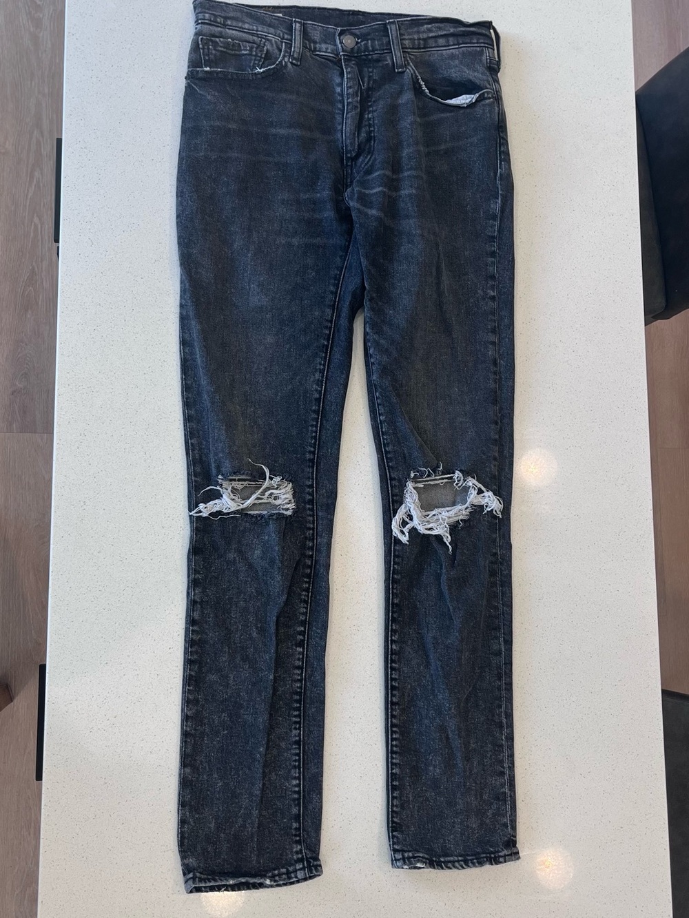 Levi's Washed Black Slim Jeans with Knee Rips